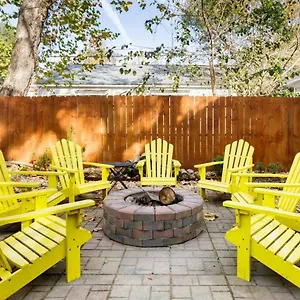 Vibrant, Colorful Building With Backyard Firepit And Games Savannah